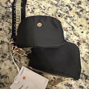 NWT lululemon athletica Black dual pouch wristlet with Gold Hardware